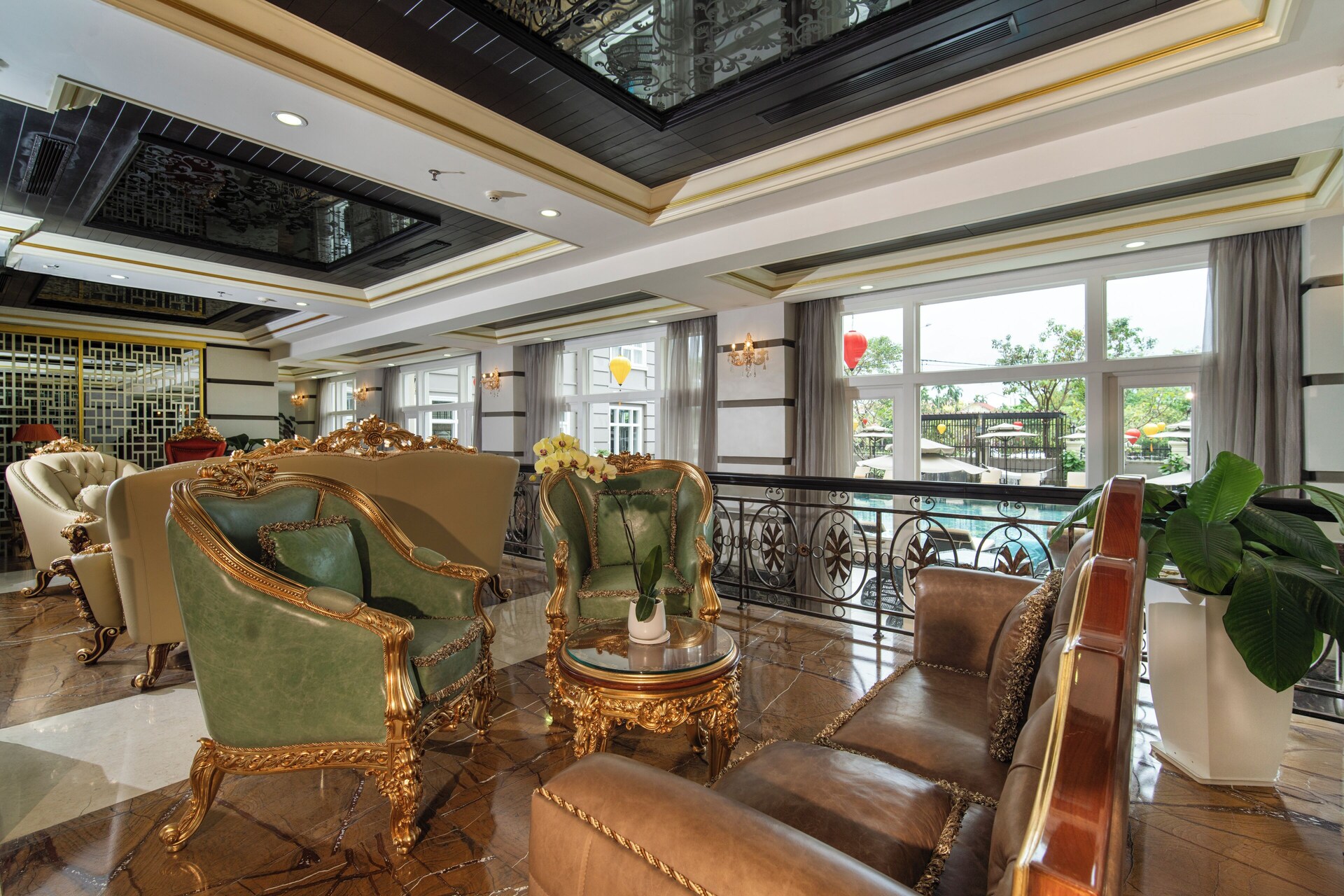 Lobby lounge vignette with modern furniture at Hotel Royal Hội An Danang