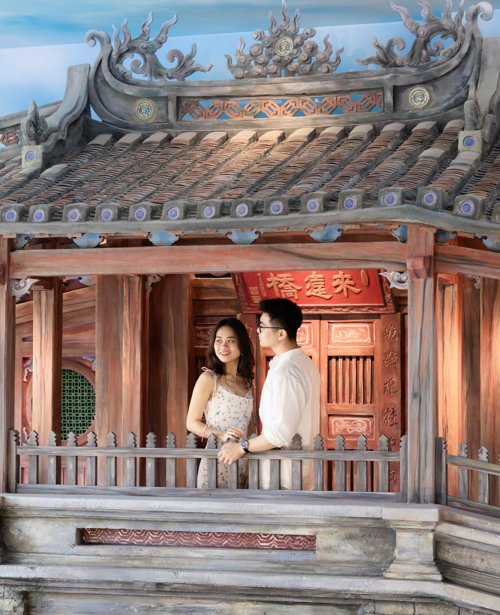 Garden walkway next to a reflective pool at Wafaifo Resort Hội An