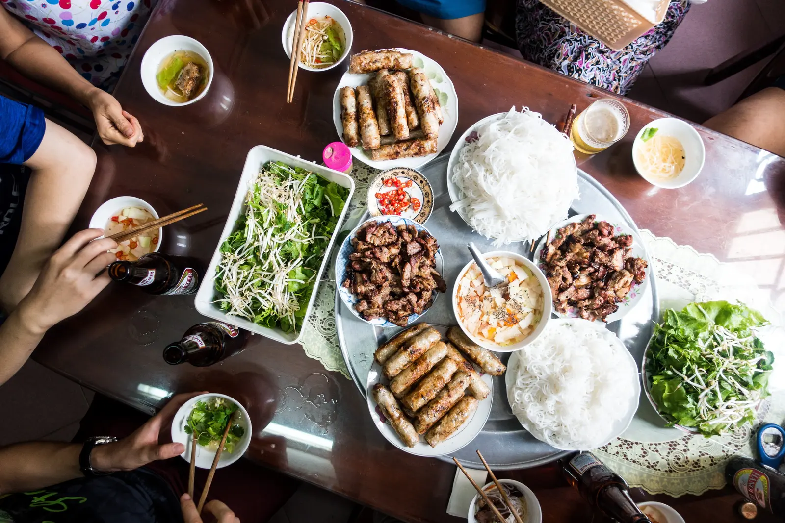 Family enjoying Vietnamese dishes together