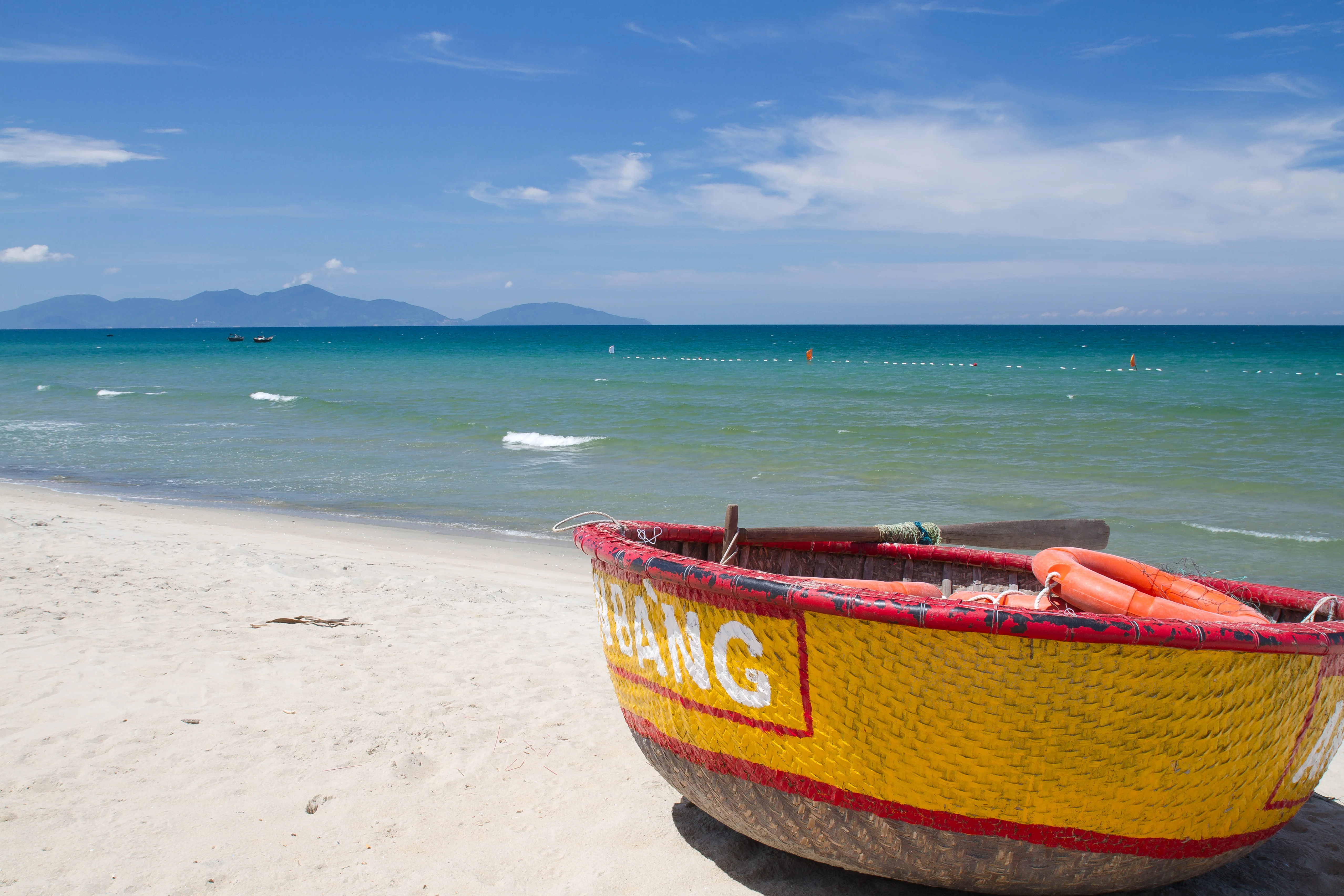 Traditional Vietnamese basket boat floating near the coast