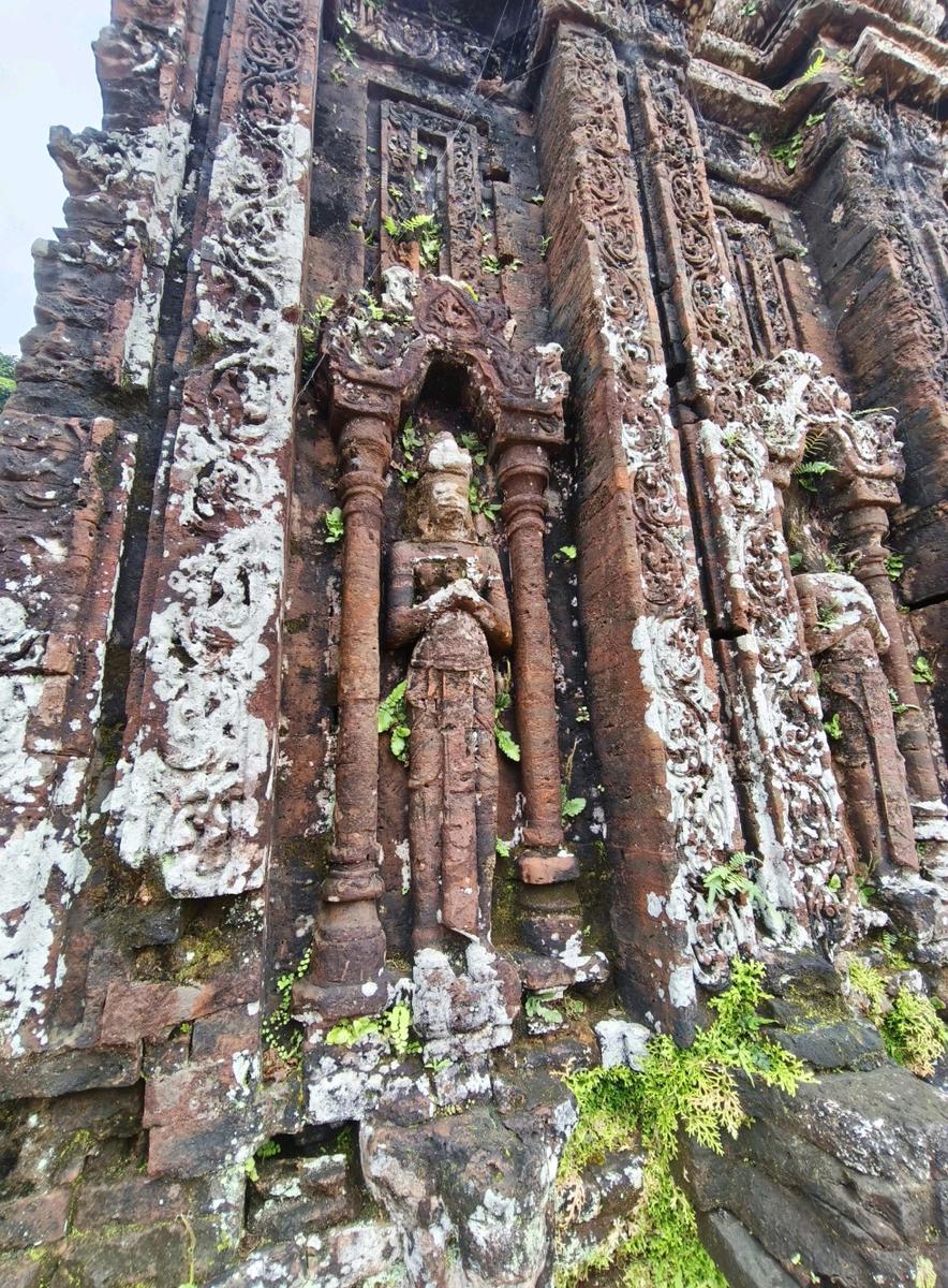 Travelers walking through Mỹ Sơn ruins