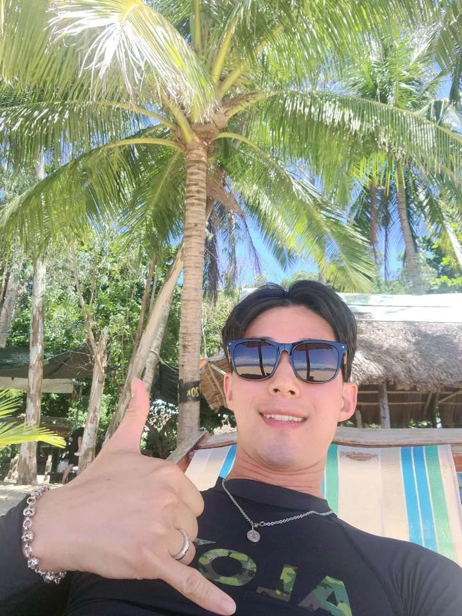Guests posing with snorkeling gear on the beach
