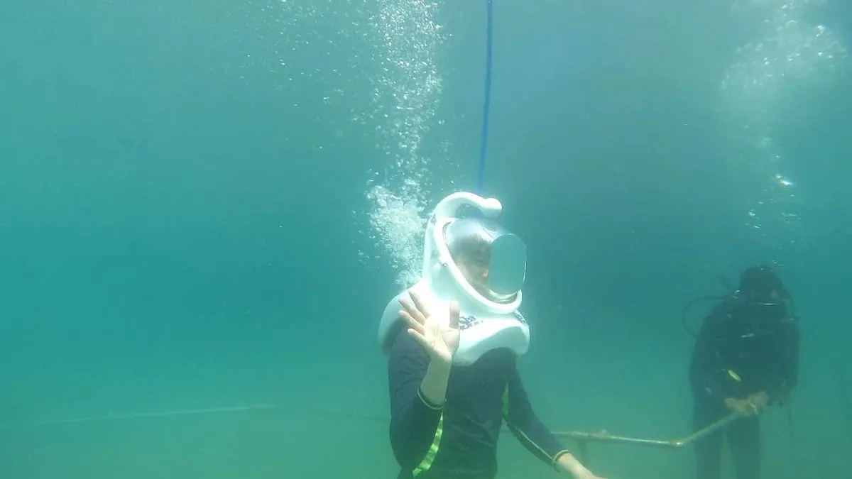 Sea walker exploring coral gardens