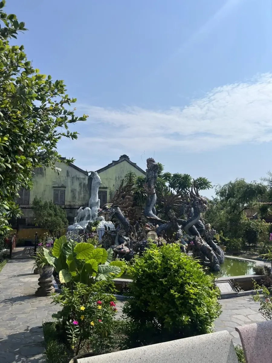 Garden sculptures surrounding a pond