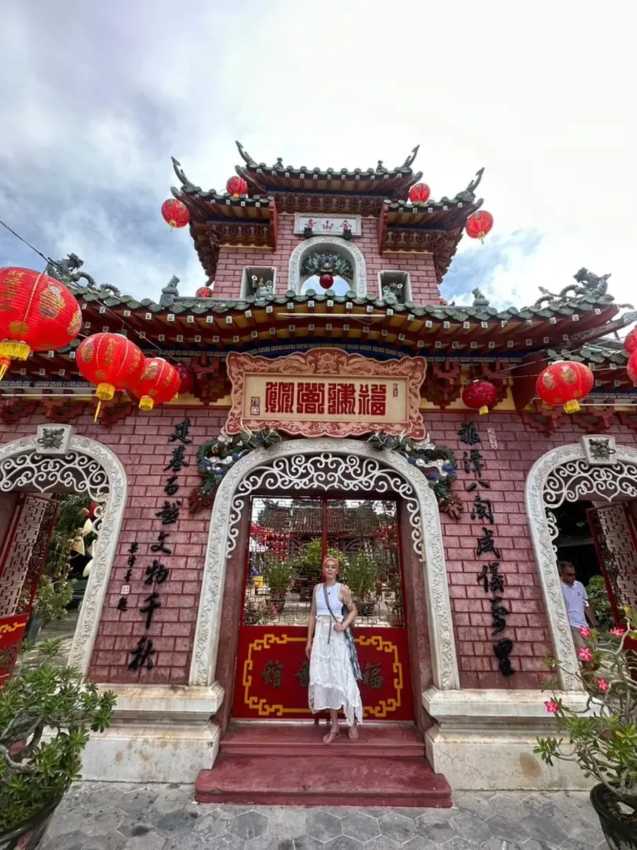 Posing outside a Chinese assembly hall